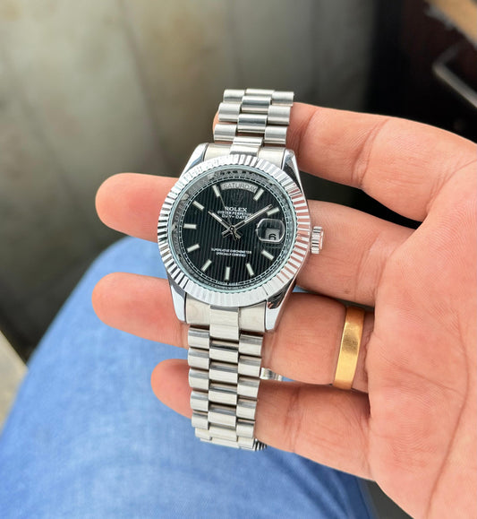 Rolex Day-Date 40mm Black Dial With Silver Belt